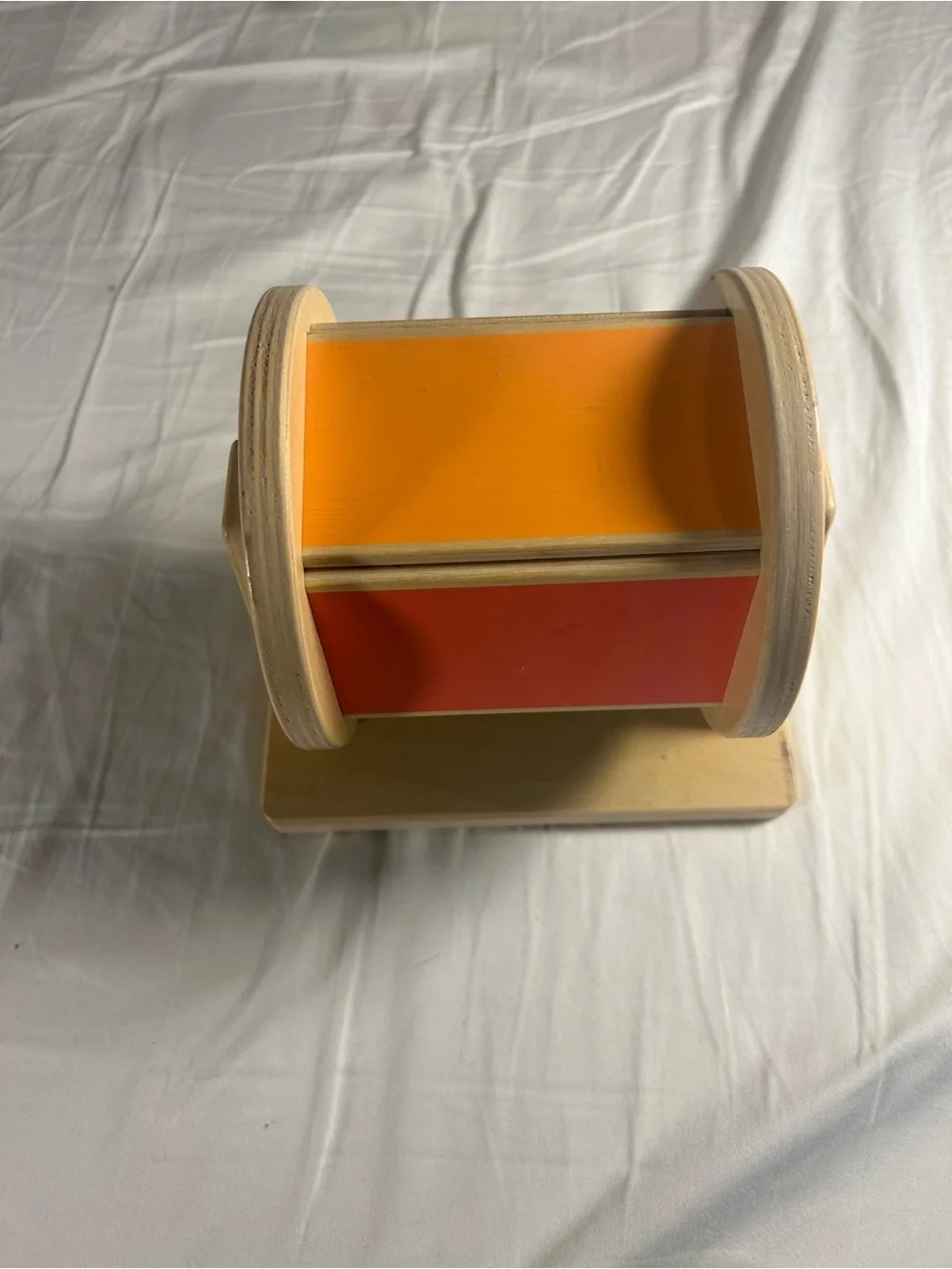 Lovevery Wooden Rotating Toy with Orange and Red Panels
